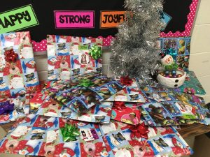 A picture of our classroom kindness tree, and all the student presents underneath!