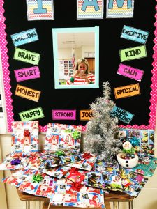 A picture of our classroom kindness tree, and all the student presents underneath!